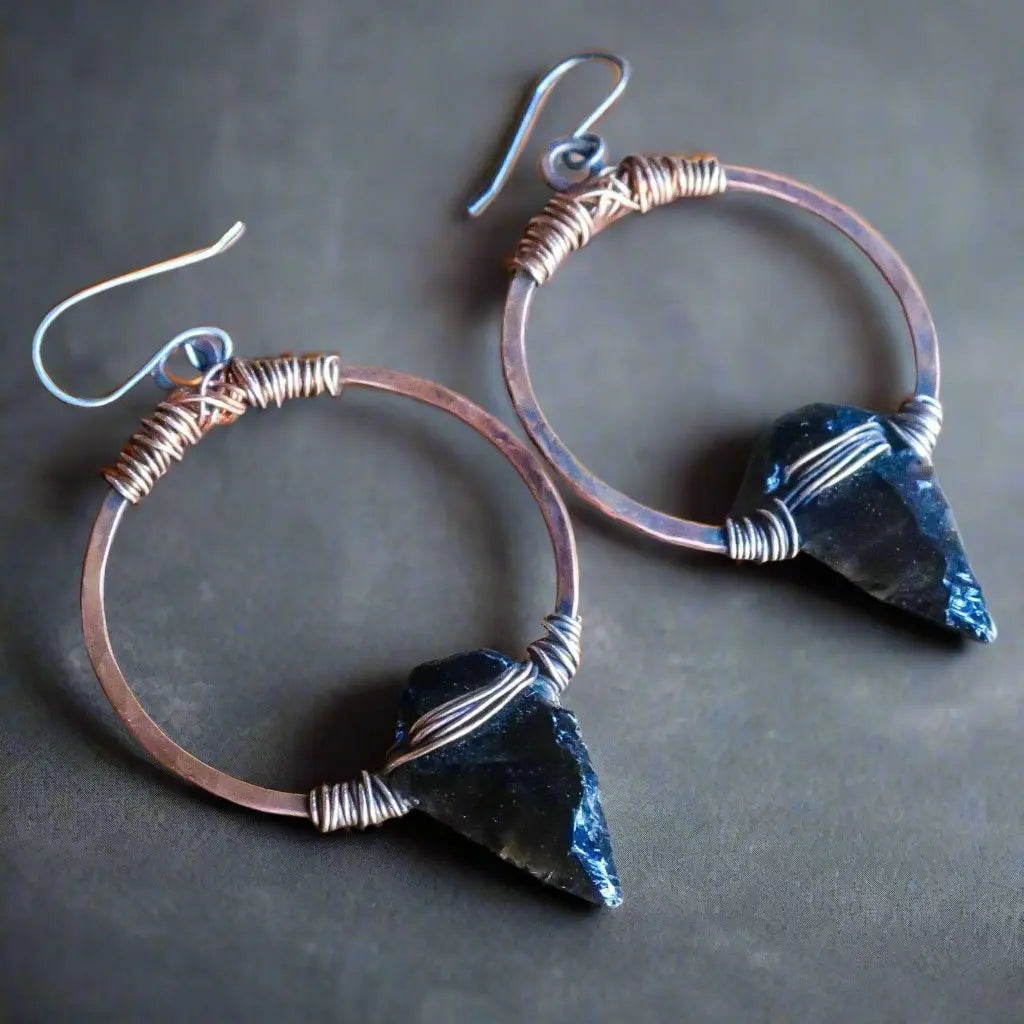 Moon Arrows copper earrings with antler stampings and orange/black top patina